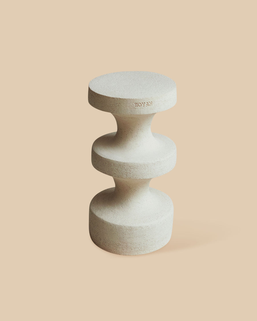 White stoneware clay architectural accent piece featuring an elegant and versatile stacked design.
