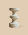 White stoneware clay architectural accent piece featuring an elegant and versatile stacked design.