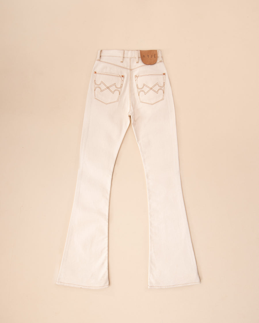 The Joelly Denim Flare Pants In Antique Ivory