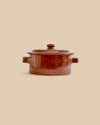 handmade deep red oven-safe artisan clay casserole dish with leaf-like patterns