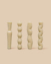 set of four unique natural colored sculptural candles in 100% beeswax