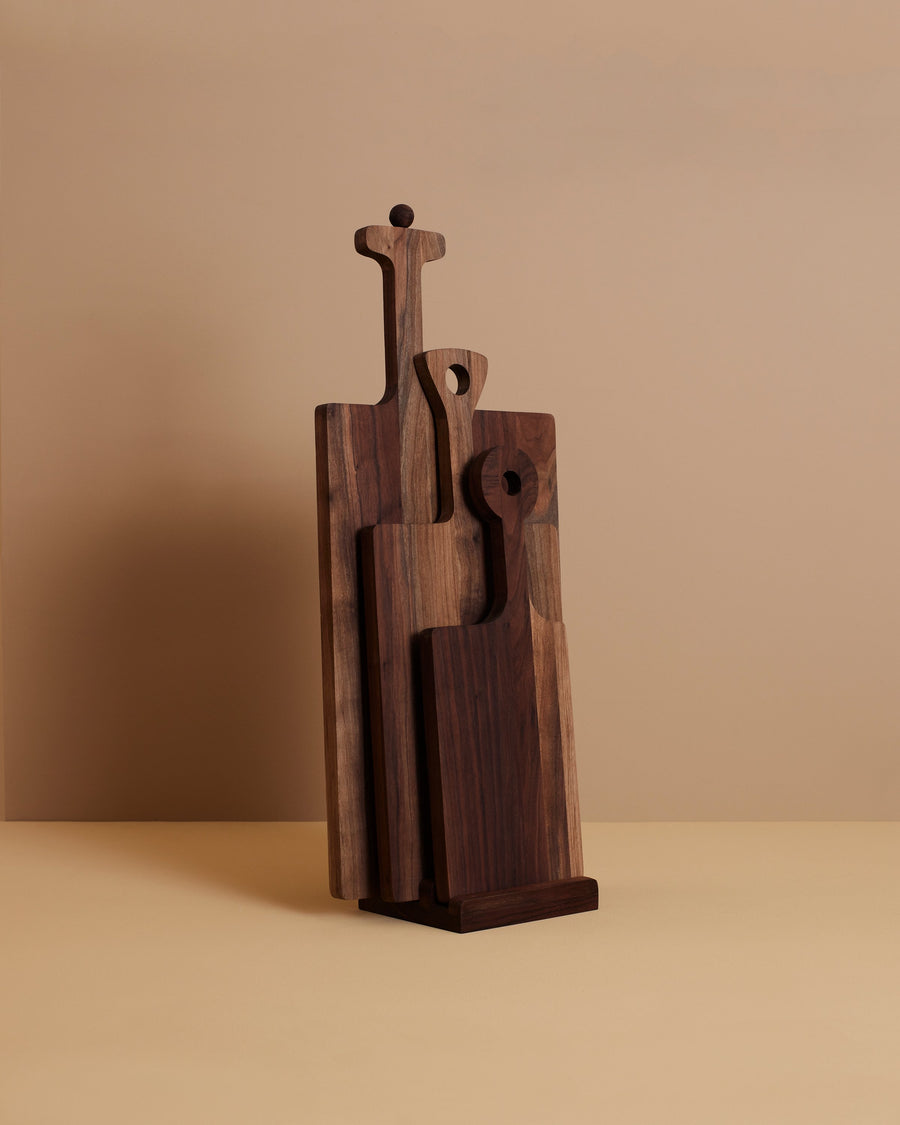 three distinctive hand oiled and waxed walnut wooden serving boards