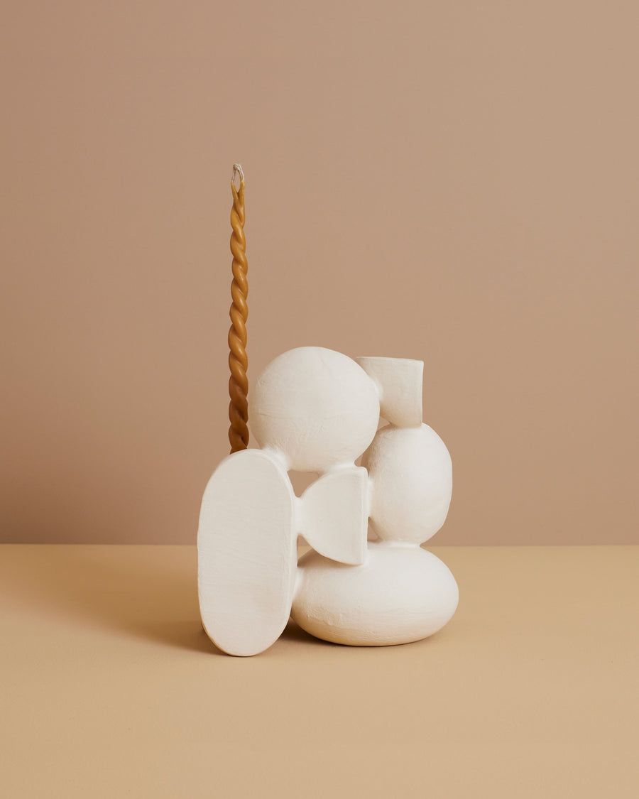 beige handbuilt ceramic end table decor and candlestick holder in an abstract collection of rounded shapes