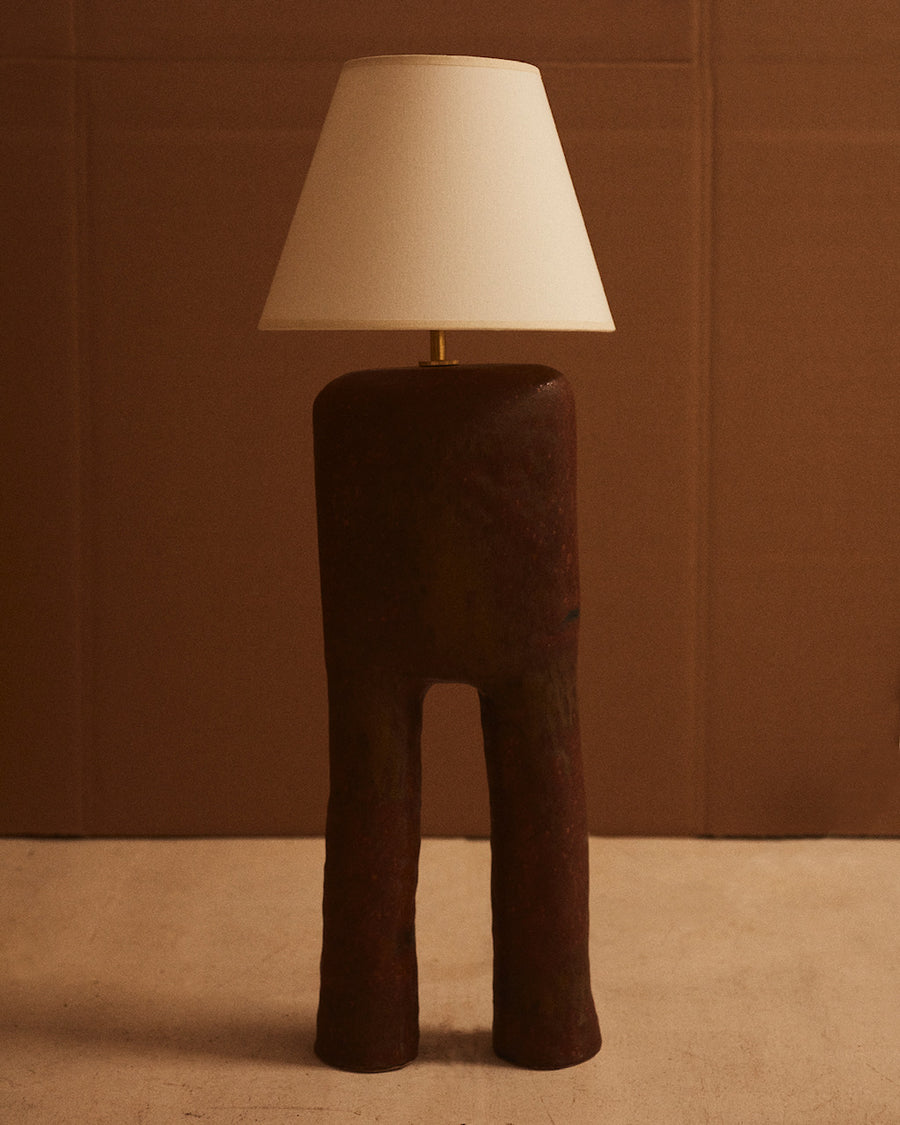 dark brown handmade Mediterranean humanesque ceramic lamp base with parchment shade