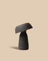 cozy handcrafted black ceramic mushroom-shaped table lamp with ambient lighting