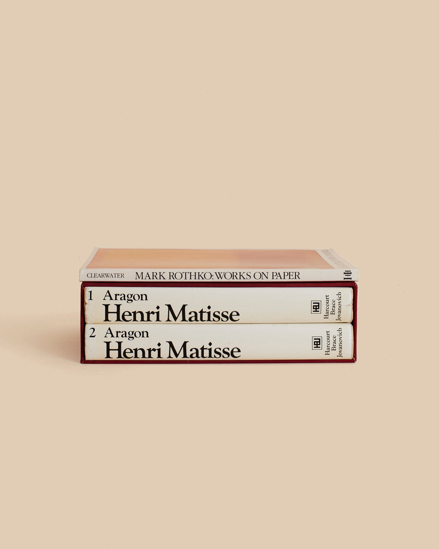 The Red Studio Book Stack by Maison Plage for Arjé, three cream and red books on Matisse and Rothko