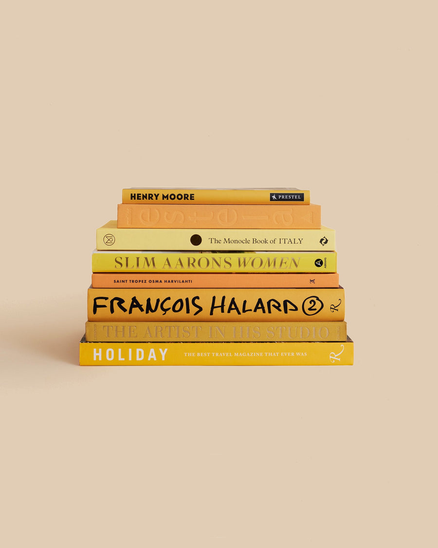 The Sunshine Book Stack by Maison Plage for Arjé, eight yellow-toned books on travel, art, photography and food