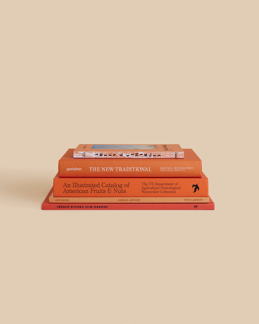 The Blood Orange Book Stack by Maison Plage for Arjé, five orange-covered books on food, travel, art and photography