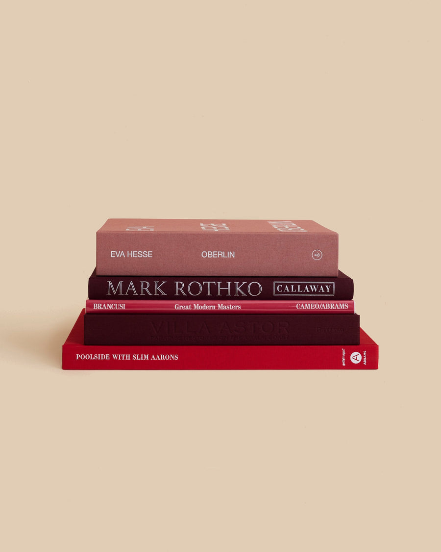 The Rouge Book Stack by Maison Plage for Arjé, five red and burgundy books on Rothko, Eva Hesse, Brancusi and Slim Aarons