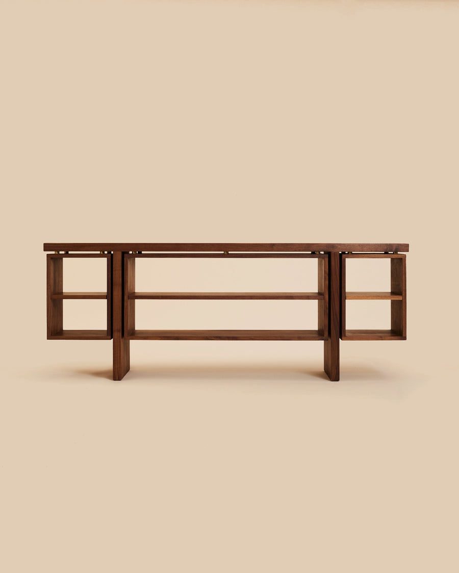 walnut wood credenza with free-floating open shelving and bronze fittings