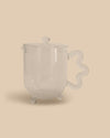 Sophie Lou Jacobsen Bloom Teapot, designed in collaboration with The Qi. Playful teapot with a transparent design, perfect for steeping flowers or any tea.
