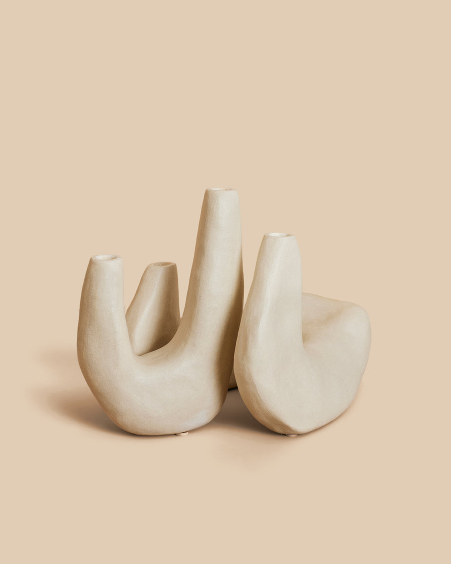 Candelabra No. 1 by Re Jin Lee, a cream hand-built ceramic candelabra with three upright curving arms