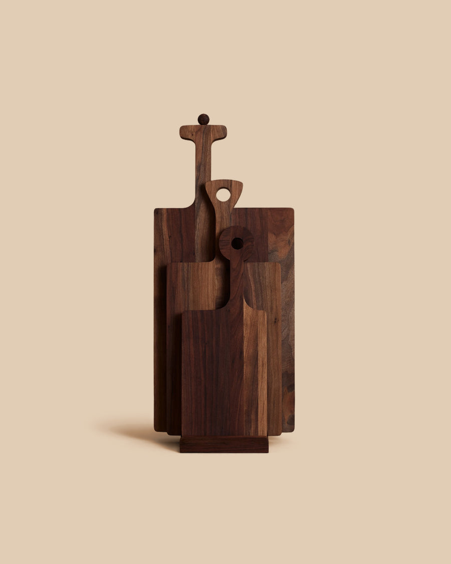 three distinctive hand oiled and waxed walnut wooden serving boards