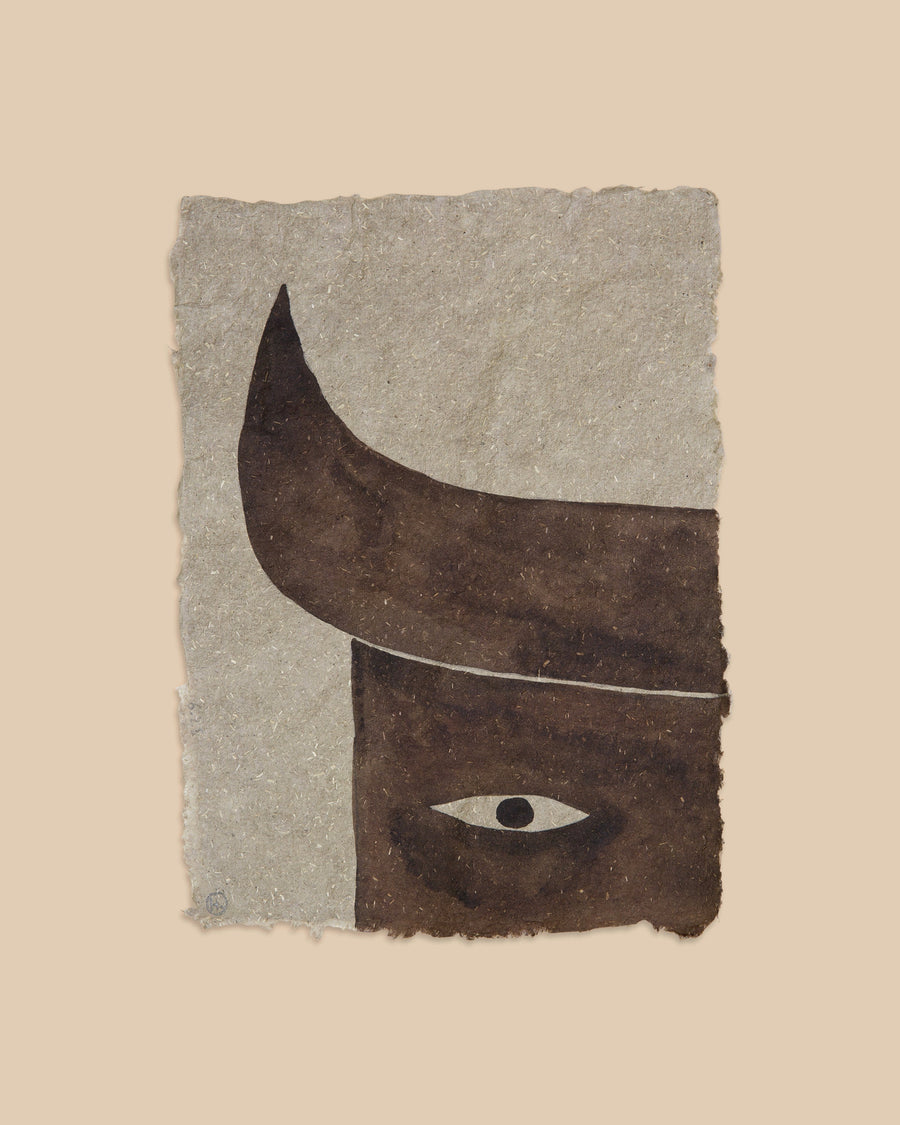 Watercolour on grey handmade paper by Hermentaire, a dark brown horned form with one wide open eye held at its centre
