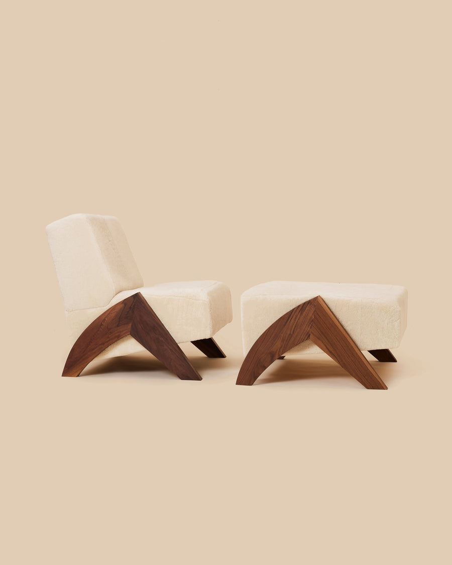 Enzo Shearling Chair and Ottoman by Arjé, natural shearling daybed with black walnut legs, front view, made to order in California