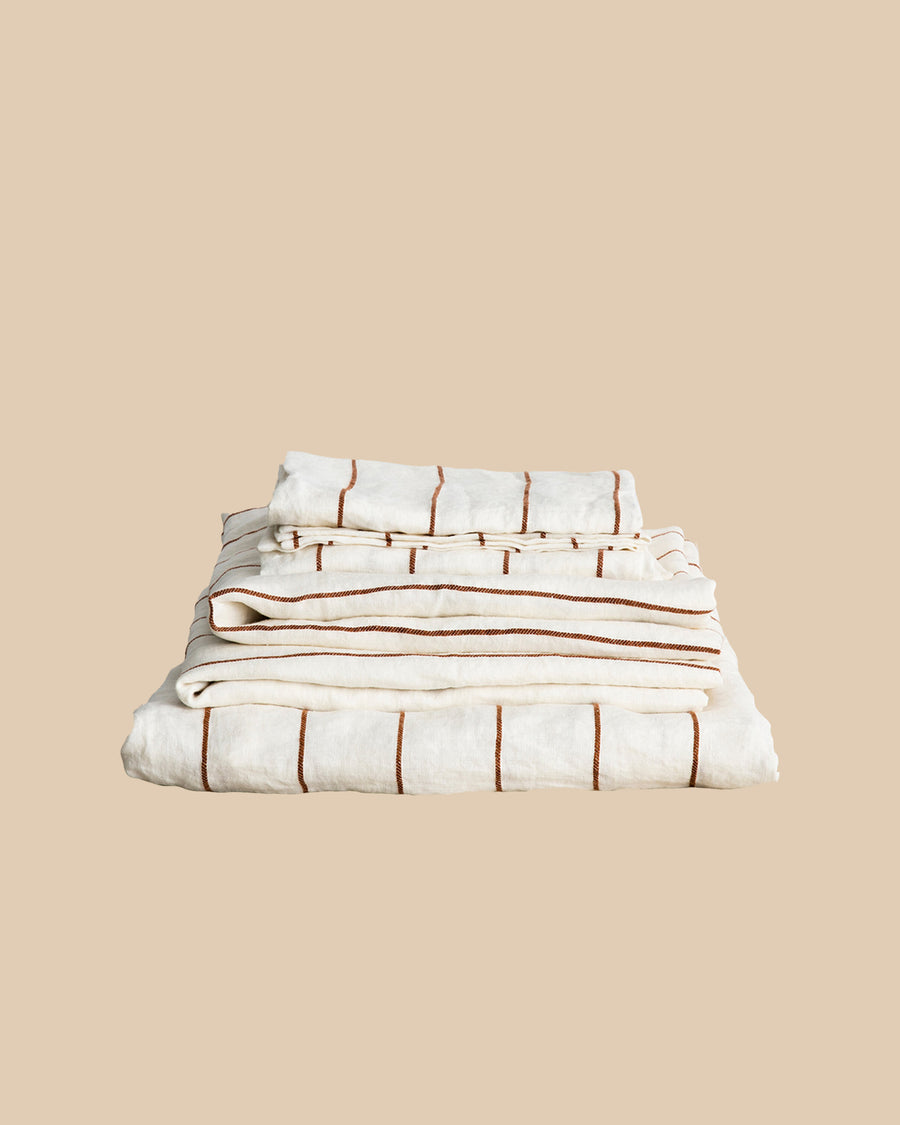 pre-washed terracotta and ivory striped linen sheets + pillowcases