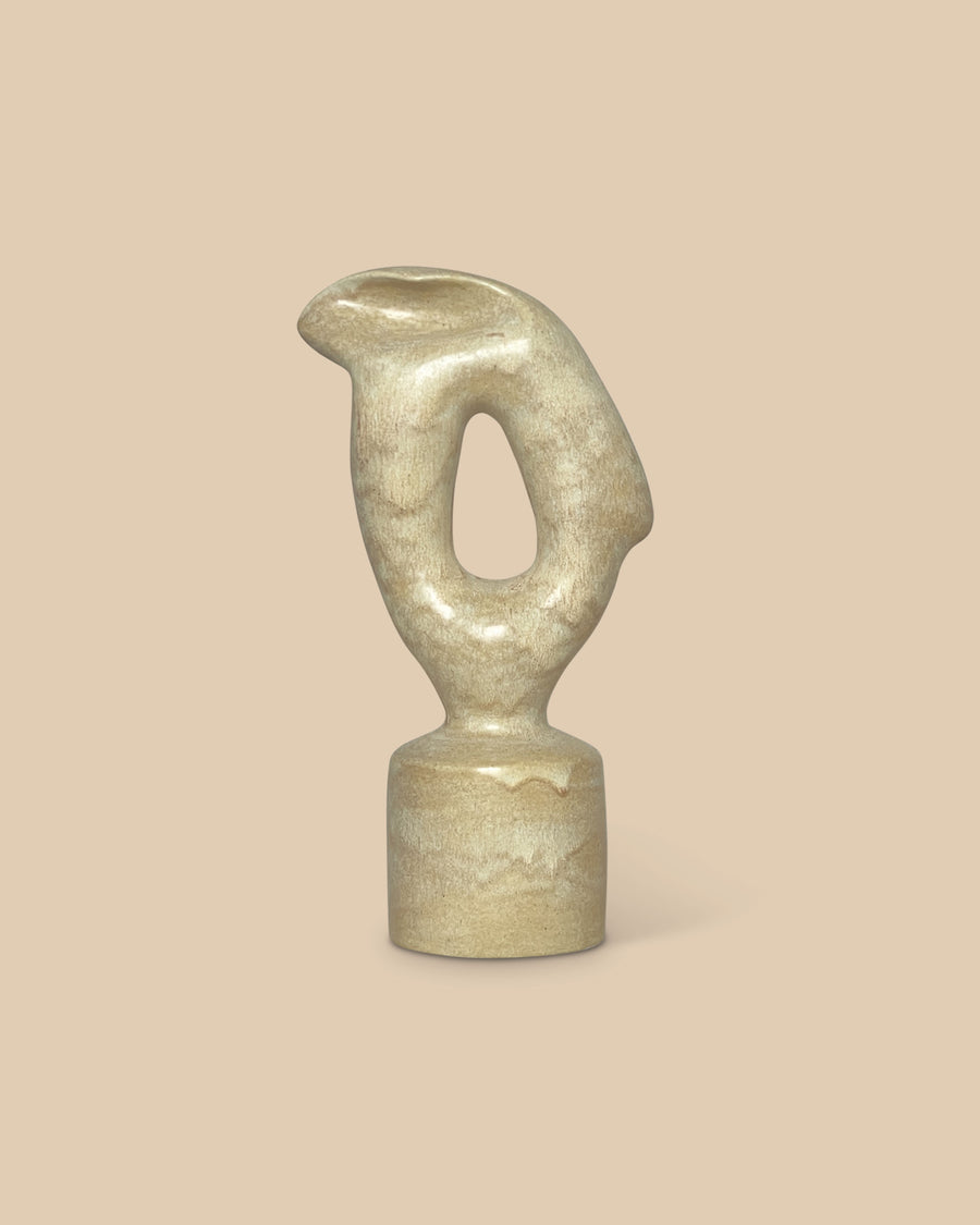 Handmade beige glazed ceramic sculpture with abstract organic form on cylinder base.