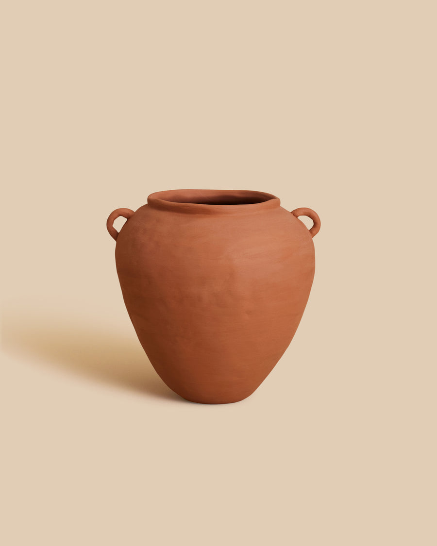 Small Round Vase by Marta Bonilla, a round terracotta stoneware vase with two small lug handles at the rim