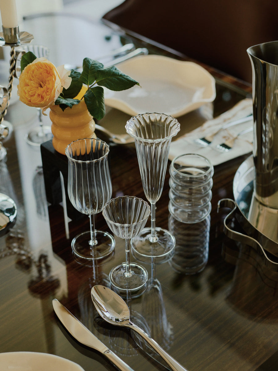 A close-up of the elegant Tulip Wine Glass with fluted design and sleek stem, perfect for wine and sparkling beverages.
