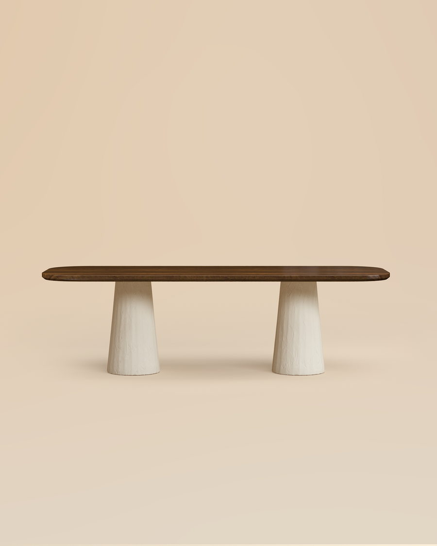 stylized image of modern walnut oval dining table with ivory cylindrical plaster legs