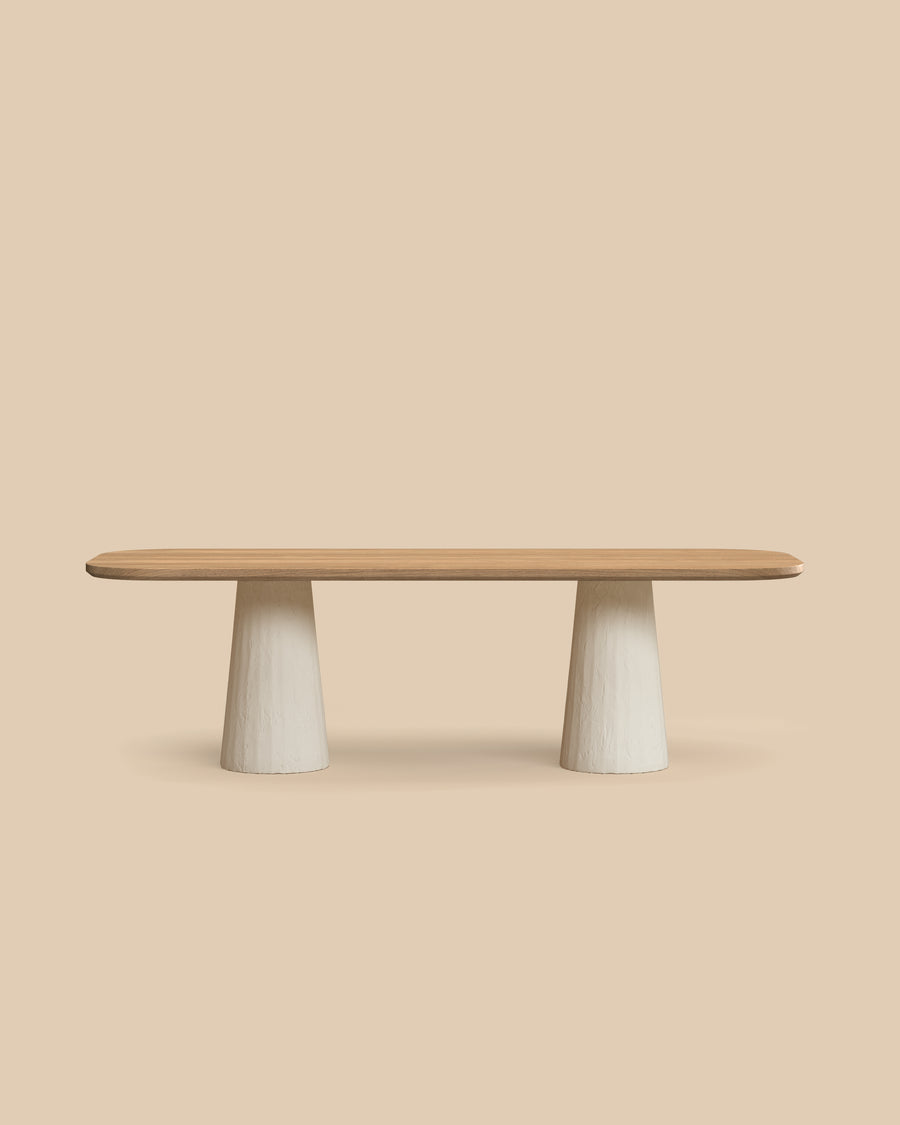 Tessa Dining Table by Arjé, solid oak oval dining table with cylindrical plaster legs, styled kitchen view, made to order in California