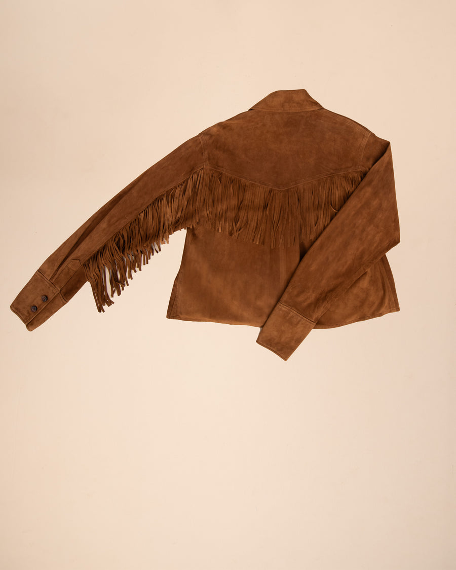 Bettina fringe suede shirt in plush brown suede, with hand-cut fringes extending from sleeves to body, offering versatile wear options.