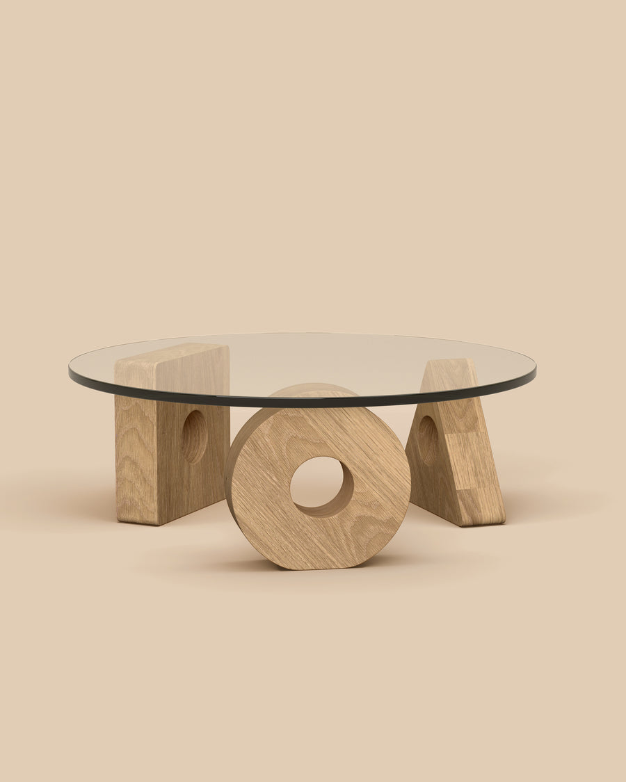 Cosmo Coffee Table by Arjé in oak, glass top on three hand-carved oak geometric forms, front view, made to order in California