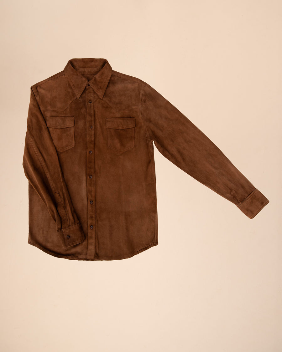 Brown suede shirt in supple suede, versatile for layering or standalone wear. Adds texture to casual outfits, improves with age, unisex fit.