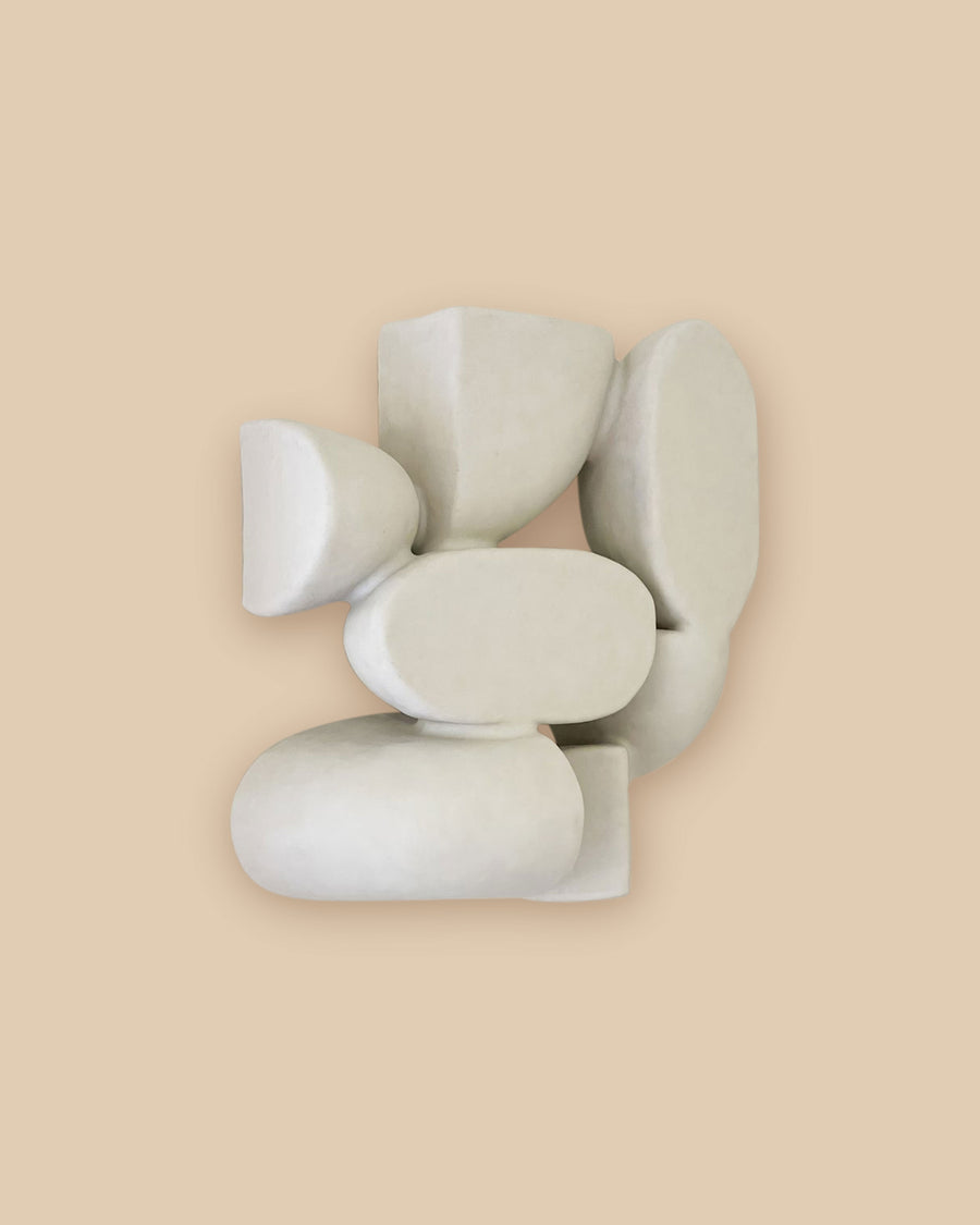 Minimalist one-of-a-kind ceramic wall decor with tactile organic white shapes.