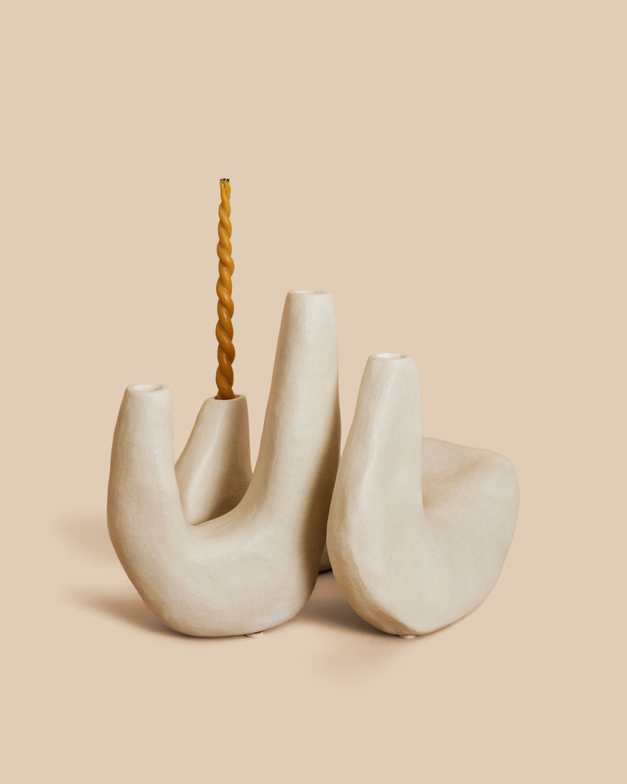Candelabra No. 1 by Re Jin Lee, a cream hand-built ceramic candelabra with three upright curving arms