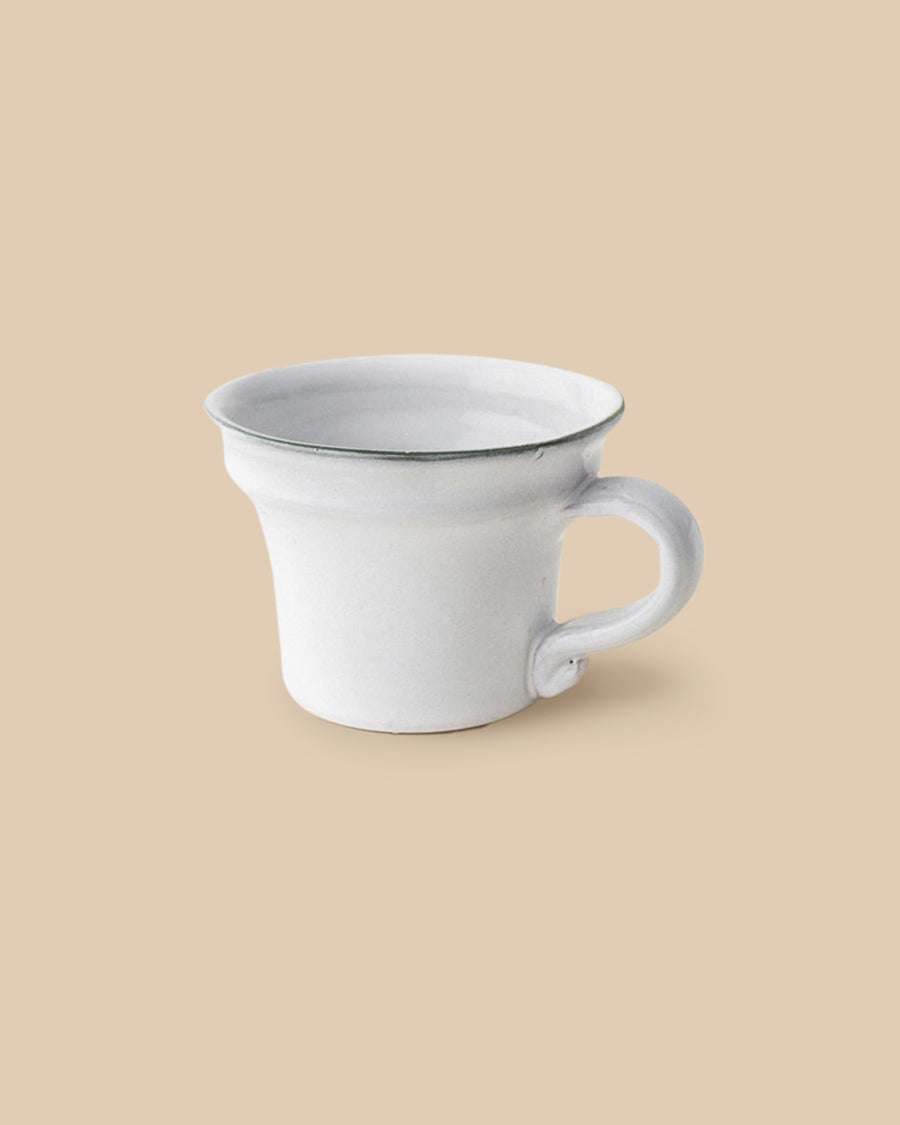 elegant white handmade dishwasher safe ceramic tea cup with green rim side view