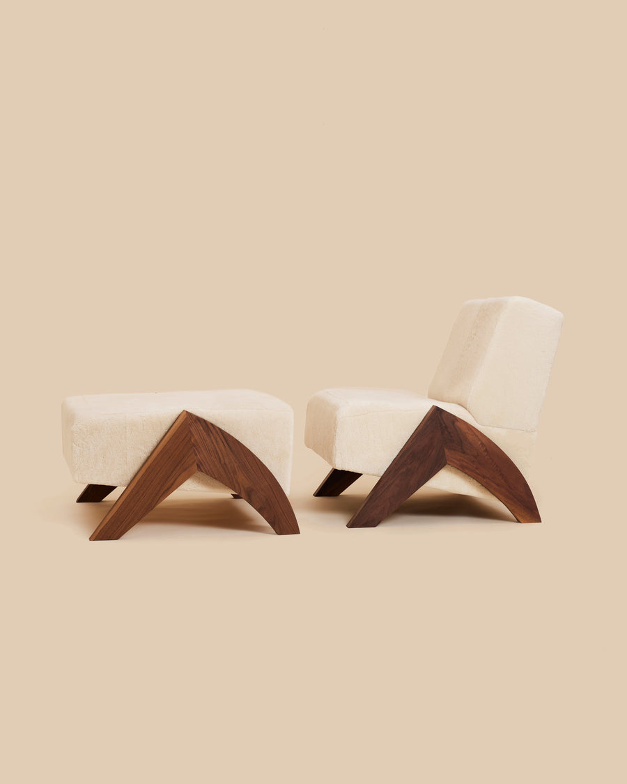 Enzo Shearling Chair and Ottoman by Arjé, natural shearling daybed with black walnut legs, front view, made to order in California