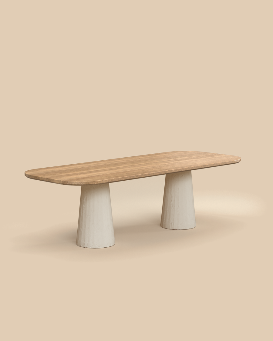 Tessa Dining Table by Arjé, solid oak oval dining table with cylindrical plaster legs, styled kitchen view, made to order in California