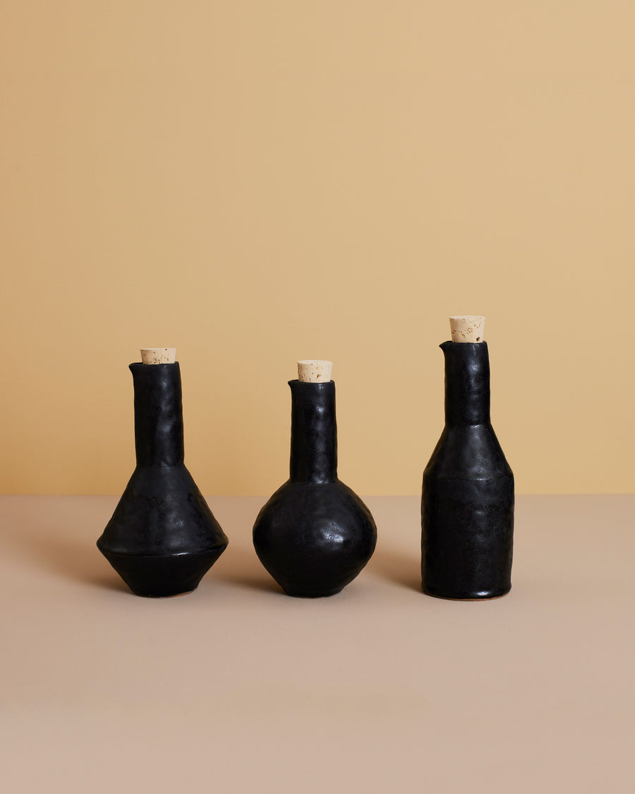 Bottle Trilogy in black stoneware — hand built by Giselle Hicks