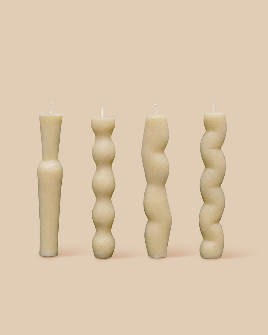 set of four unique natural colored sculptural candles in 100% beeswax