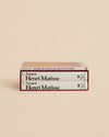 three cream and red books about matisse and rothko in an art lover's bookstack