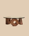  round glass coffee table on a base of three walnut wood geometric shapes