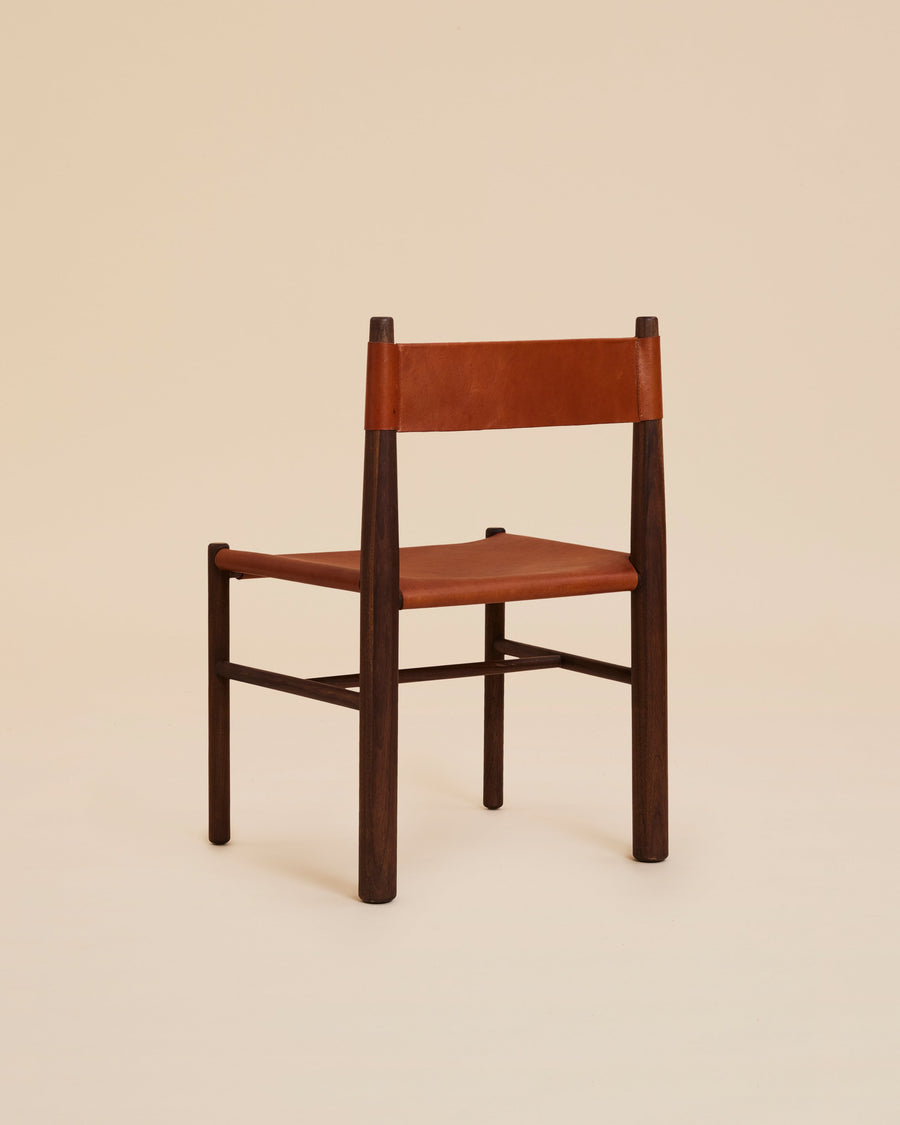 turned walnut wood dining chair with cognac leather sling seat and backrest