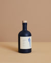 premium extra virgin organic greek olive oil in a navy blue bottle