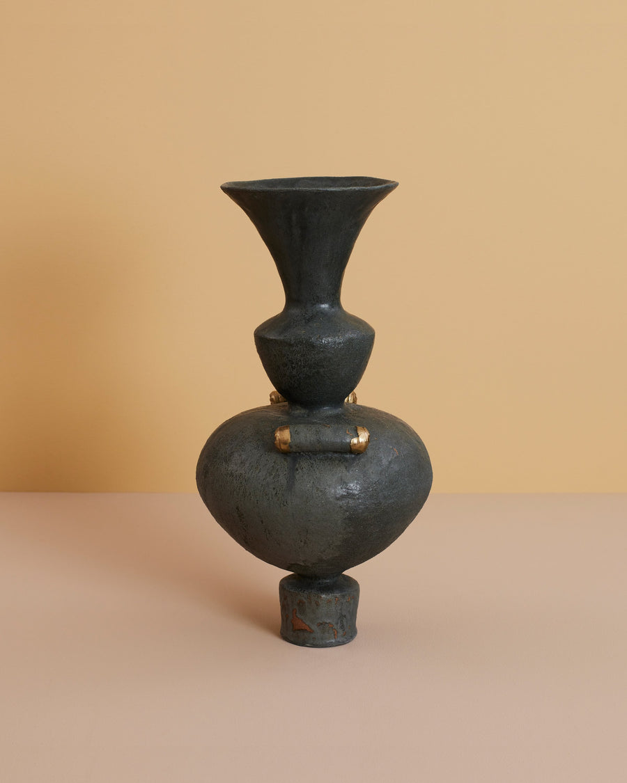 dark grey sculptural stoneware centerpiece vase made by hand with brass detailing inspired by ancient greek vessels