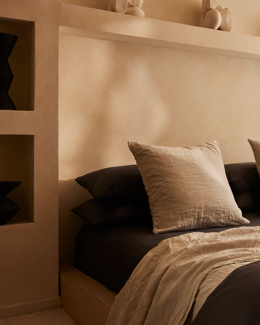 two natural light brown pre-washed linen Euro pillowcases on bed