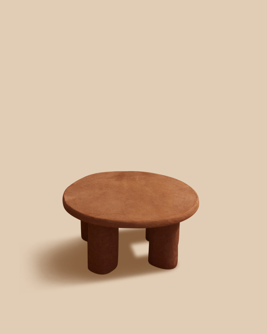 brown handmade Mediterranean stoneware circular low side table on four pillar legs