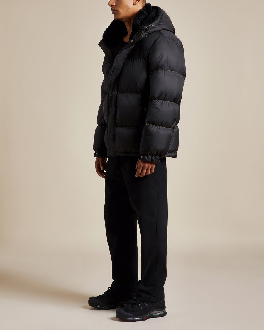 black nylon water resistant unisex puffer jacket with shearling lined hood and collar