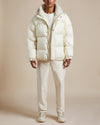 ivory nylon water resistant unisex puffer jacket with shearling lined hood and collar